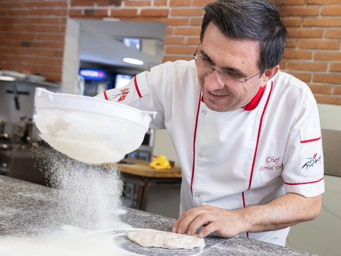 Sef Kemal rolls out dough with all his skill
